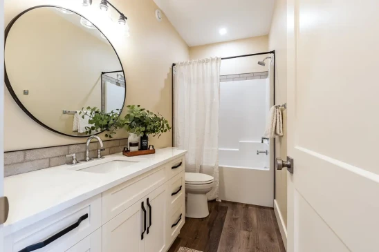 Bright full bathroom in a Ready to Move home with modern vanity, bathtub, and contemporary finishes.