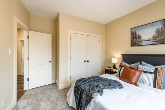 Bright guest bedroom in a Ready to Move home featuring ample natural light and generous closet space.