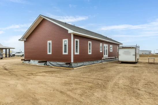 Side exterior of a custom RTM home showcasing energy efficient windows and low maintenance siding by Jade Homes.