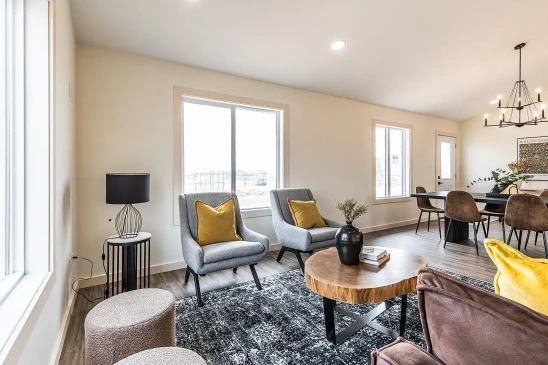 Bright RTM home interior with open living and dining layout and large picture windows in Alberta and Saskatchewan