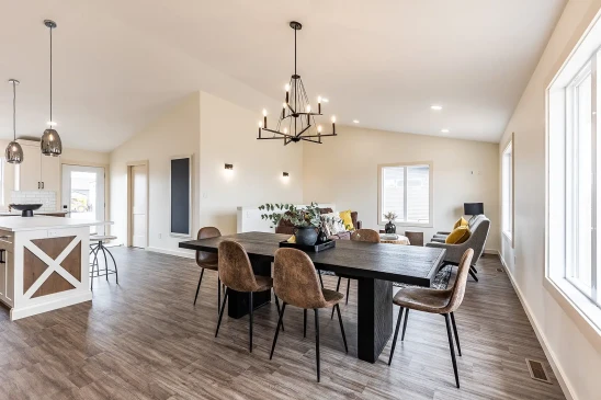 Modern RTM home interior with open kitchen, island seating and large dining area in Alberta and Saskatchewan