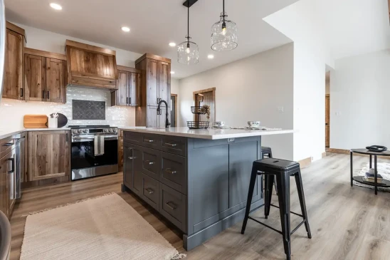 Custom kitchen in RTM home with large island, quartz countertops and wood cabinetry in Alberta and Saskatchewan