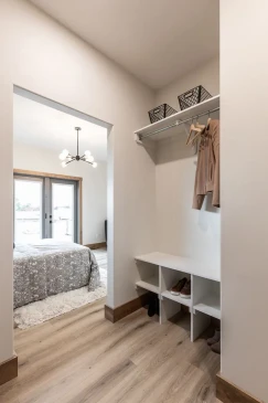 Spacious primary bedroom walk-in closet with shelving and storage cubbies in RTM home in Alberta and Saskatchewan