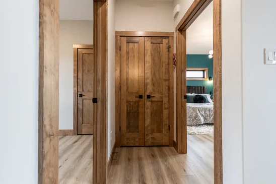 Interior hallway featuring solid wood doors and trim in custom RTM home in Alberta and Saskatchewan