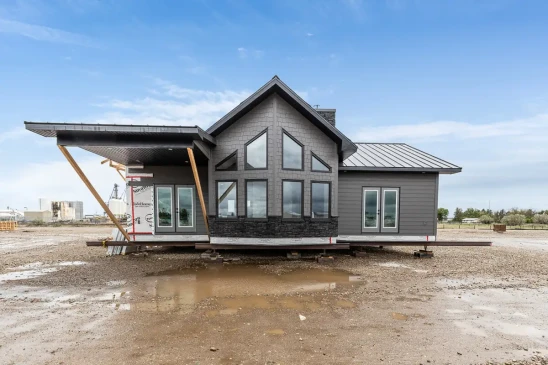 Contemporary RTM home under construction with large windows and metal roof, ready-to-move home in Alberta and Saskatchewan