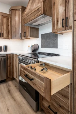 Custom kitchen cabinetry with built-in spice drawer in RTM home in Alberta and Saskatchewan