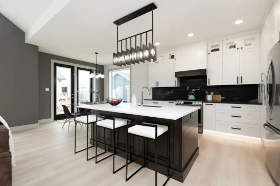 Spacious kitchen with oversized island, custom cabinetry, and open concept layout in a Ready to Move home.