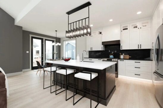 Spacious kitchen with oversized island, custom cabinetry, and open concept layout in a Ready to Move home.